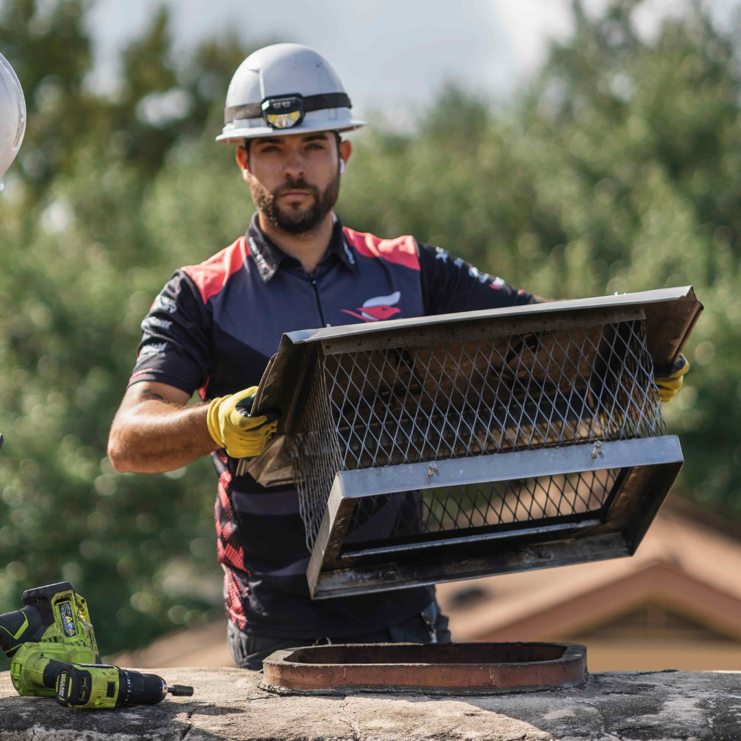Chimney X Tech installing a chimney cap
